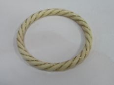 Late 19th century ivory rope twist bracelet with 14k gold wire banding. Estimate £80-120