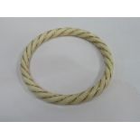 Late 19th century ivory rope twist bracelet with 14k gold wire banding. Estimate £80-120