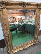 Very large decorative gilt framed bevel edge wall mirror.