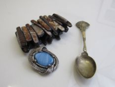 Scottish brooch, ivory figure, George V silver jubilee spoon & an Abalowne bracelet. Estimate £20-