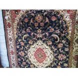 Blue ground Keshan rug. Estimate £60-80