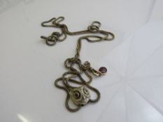 Chain necklace with an owl head pendant, marked 14ct, gold plated, with 2 red stones, weight 22gms,