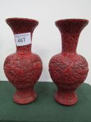 Pair of oriental cinnabar vases, height 30cms. Estimate £60-80