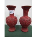 Pair of oriental cinnabar vases, height 30cms. Estimate £60-80