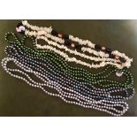 3 sets of different coloured fresh water pearls & 2 mother of pearl necklaces. Estimate £20-30