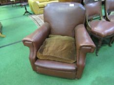 Brown faux leather armchair. Estimate £20-40