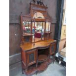 Mahogany Edwardian display cabinet with carved panels & mirrored back, 127cms x 43cms x 228cms.