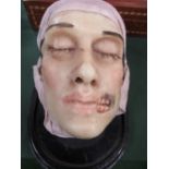 French anatomical wax death mask of a man with hole in face. Estimate £190-240