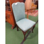 Green upholstered side chair.