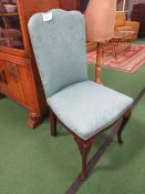 Green upholstered side chair.