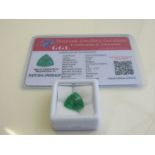Natural trillion cut loose emerald, weight 6.70 carat, with certificate. Estimate £50-70.