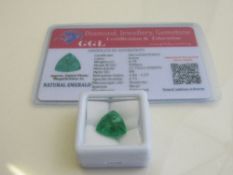 Natural trillion cut loose emerald, weight 6.70 carat, with certificate. Estimate £50-70.