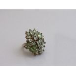Gold over silver peridot large cluster cocktail ring, size O. Estimate £20-30.