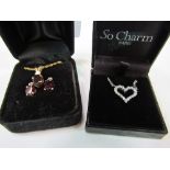 Gold coloured necklace & earring set with red stone & a silver heart shaped necklace. Estimate £10-