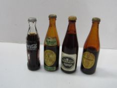 Miniature Coca Cola bottle & 3 miniature Guinness bottles. Estimate £20-30