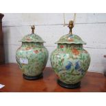A pair of oriental style table lamps. Estimate £30-50