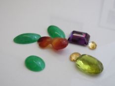 Large oval shaped citrine stone, 2.4cms x 1.5cms x 1.3cms; large amethyst 2cms x 1.6cms x 9cms; 2