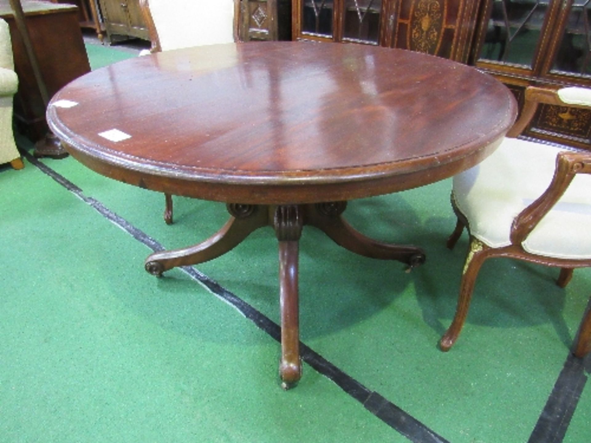 Mahogany circular tilt-top table on heavy turned column to 3 scrolled feet with casters, diameter - Image 2 of 3