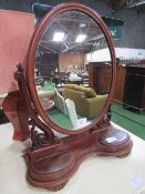 Oval shaped toilet mirror on mahogany carved stand, c/w 2 jewellery boxes, height 80cms.