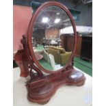 Oval shaped toilet mirror on mahogany carved stand, c/w 2 jewellery boxes, height 80cms.