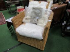 Cane armchair c/w cushions & covers. Estimate £30-40