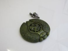 Carved jade pendant & a 925 silver ram's head pendant. Estimate £20-40