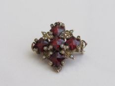 Victorian Cross shaped red stone & seed pearl brooch, 2cms x 2cms. Estimate £50-80