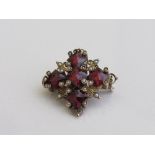 Victorian Cross shaped red stone & seed pearl brooch, 2cms x 2cms. Estimate £50-80