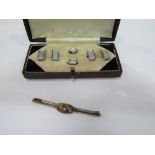 Mother of pearl cufflinks & studs (boxed) & a rolled gotted tie pin with purple stone. Estimate £