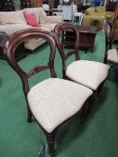 8 mahogany balloon back dining chairs with upholstered seats.