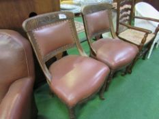 2 oak framed brown leather upholstered side chairs. Estimate £20-30