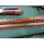 Curved hazel & curved rattan stick with hallmarked silver mounts (2). Estimate £25-30