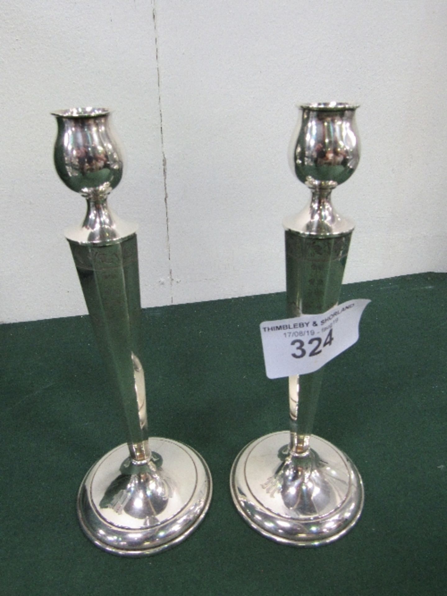 Pair of Tulip bowl candlesticks with tapered octagonal stems which are bright cut chased saucer