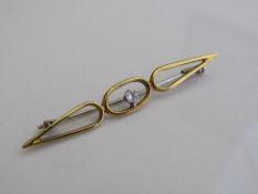 18ct gold solitaire diamond brooch in Art Nouveau style, length 5.7cms, weight 3.6gms. Estimate £