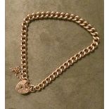 9ct gold lady's curb chain charm starter bracelet with heart lock & safety chain, weight 16.75gms.