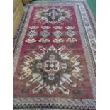 Turkish brown ground rug, 240cms x 160cms. Estimate £30-50