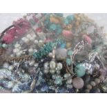 Bag of costume jewellery, many with semi-precious stones. Estimate £20-30