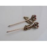 2 stick pins of seed pearl, green & pink stone floral top. Estimate £50-80