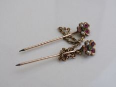 2 stick pins of seed pearl, green & pink stone floral top. Estimate £50-80