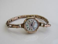 9ct rolled gold on silver cocktail watch with pearlescent face. Estimate £30-50