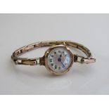 9ct rolled gold on silver cocktail watch with pearlescent face. Estimate £30-50