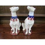 Pair of Majolica greyhound figures painted white with blue collars, height 36cms. Estimate £50-80