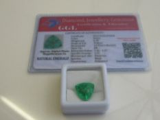 Natural trillion cut loose emerald, 6.70 carat, with certificate. Estimate £50-70.