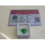 Natural trillion cut loose emerald, 6.70 carat, with certificate. Estimate £50-70.