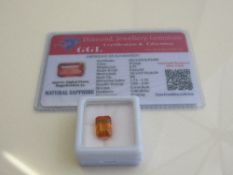 Natural emerald cut orange loose sapphire, weight 6.35 carat, with certificate. Estimate £50-70.