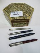 Decorated box containing 3 Parker fountain pens & a Parker propelling pencil. Estimate £20-40