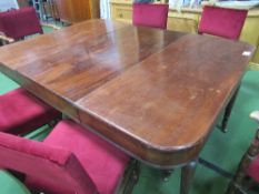 Edwardian extendable mahogany dining table on tapered fluted legs to brass casters, 180cms (