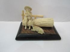 19th century Dieppe-style carved ivory figurine of herdsman on a log playing his flute with a goat