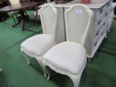 2 French-style cream coloured cane back bedroom chairs together with cream coloured cane double