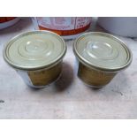 Two tubs of Gold Label show white paste; new